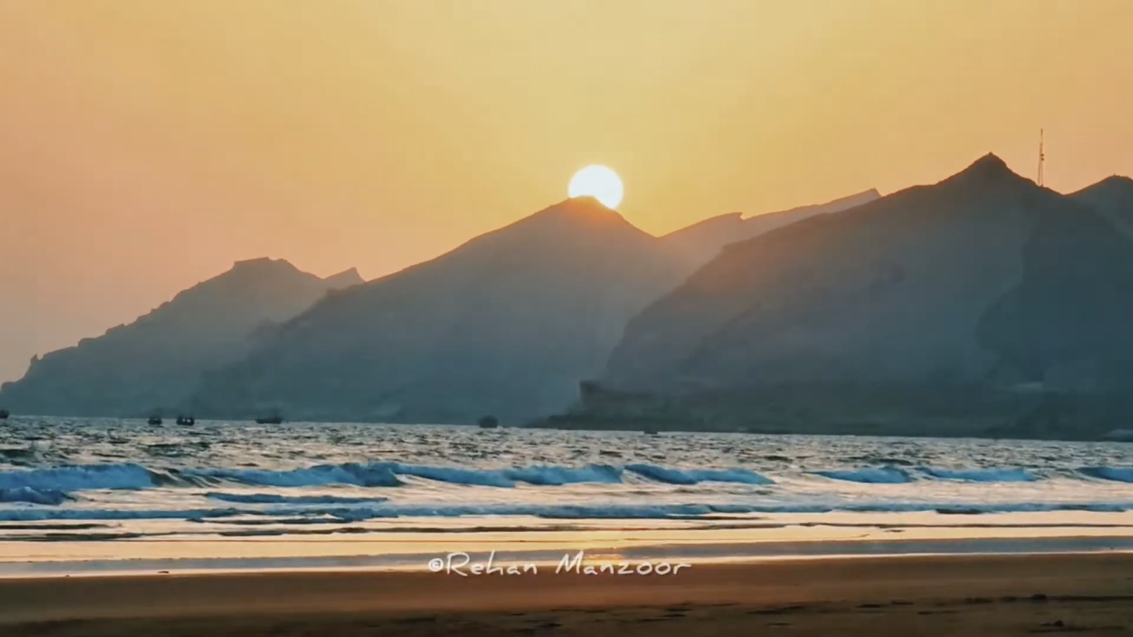 Sunset over Kund Malir Balochistan with golden sands and blue waters